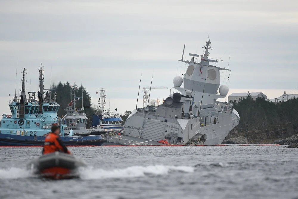 The Norwegian frigate KNM Helge Ingstad’ takes on water after collision with the tanker Sola TS on Thursday, November 8. (NTB Scanpix/AFP)