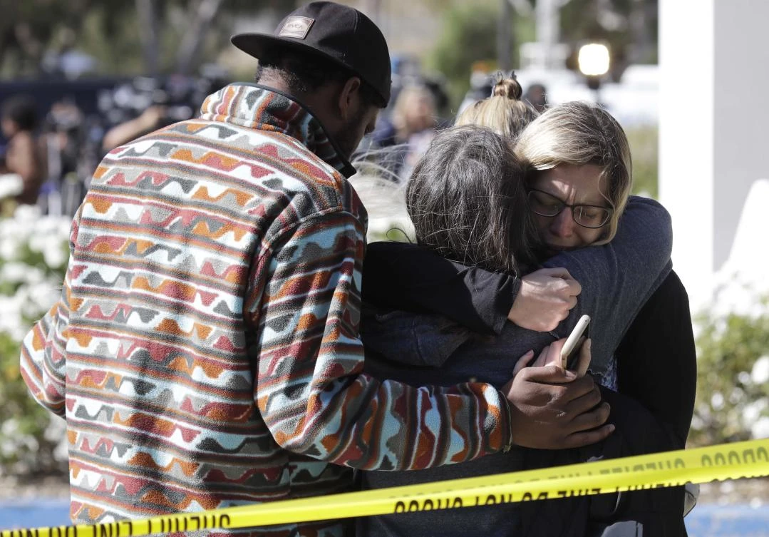 Mourners embrace outside of the Thousand Oaks Teen Center, where relatives and friends gathered in the aftermath of a mass shooting, Thursday, Nov. 8, 2018, in Thousand Oaks, Calif. (AP)