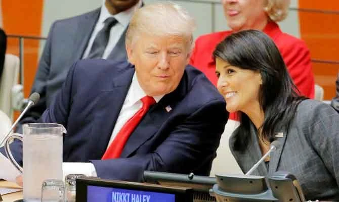 US President Donald Trump talks with US Ambassador to the UN Nikki Haley as they attend a session on reforming the United Nations at UN Headquarters in New York, US, in this September 18, 2017 file photo. (REUTERS)