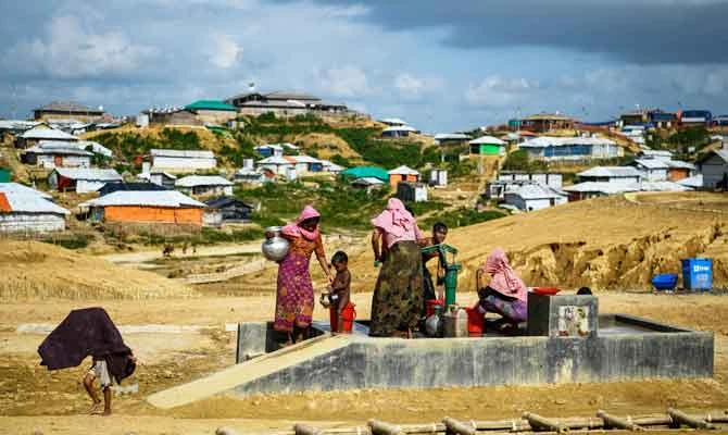 In this file photo taken on August 8, 2018 Rohingya refugees collect water at the Kutupalong refugee camp in Ukhia. (AFP)