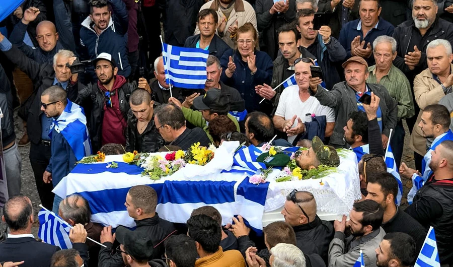 Katsifas was carried in an open casket draped with Greek flags as some mourners chanted “Konstantinos, you are alive and leading us!” (AFP)