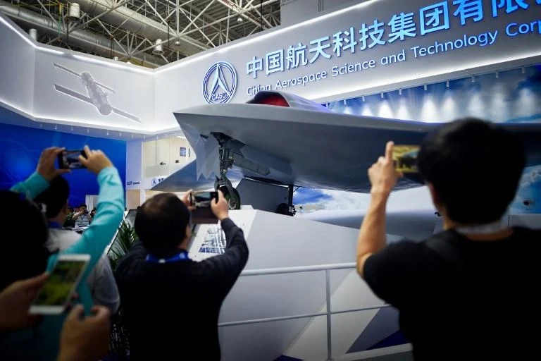 The CH-7, with a model on display above, can fly at more than 800 kilometers per hour and at an altitude of 13,000 meters. (AFP)