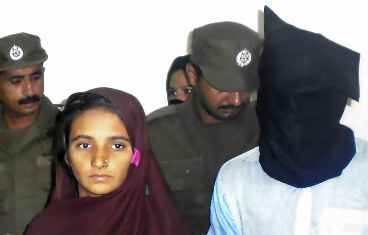 Aasia Bibi and her friend, Shahid Lashari, are presented to journalists on October 30, 2017 at police station in Muzaffargarh in Pakistan. (AP)