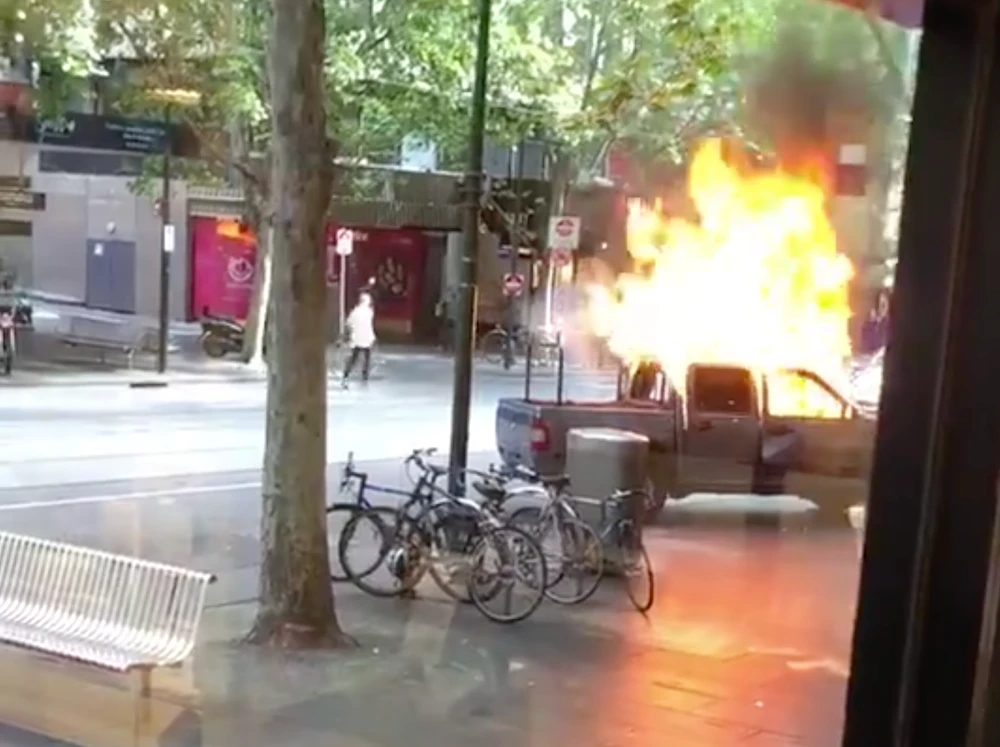 The attacker set fire to a vehicle laden with gas bottles. (Twitter video screengrab)