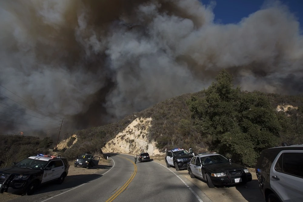 Wind-driven flames move across Malibu Creek State Park during the Woolsey Fire on November 9, 2018 near Malibu, California. (Getty Images/AFP)