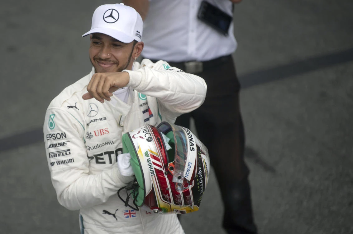 Mercedes' British driver Lewis Hamilton celebrates after taking the pole position for the F1 Brazil Grand Prix in the qualifying session at the Interlagos racetrack in Sao Paulo. (AFP)