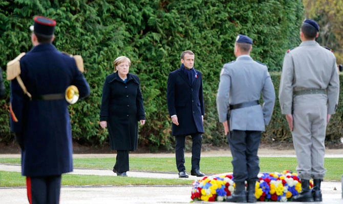 French President Emmanuel Macron, right, and German Chancellor Angela Merkel attend a ceremony in Compiegne, north of Paris, Saturday, Nov. 10, 2018. (AP)