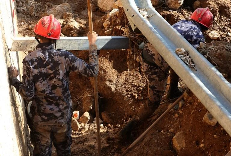 Members of the Jordanian rescue team search for missing persons following flash floods that have left a total of 13 people dead in the kingdom. (AFP)