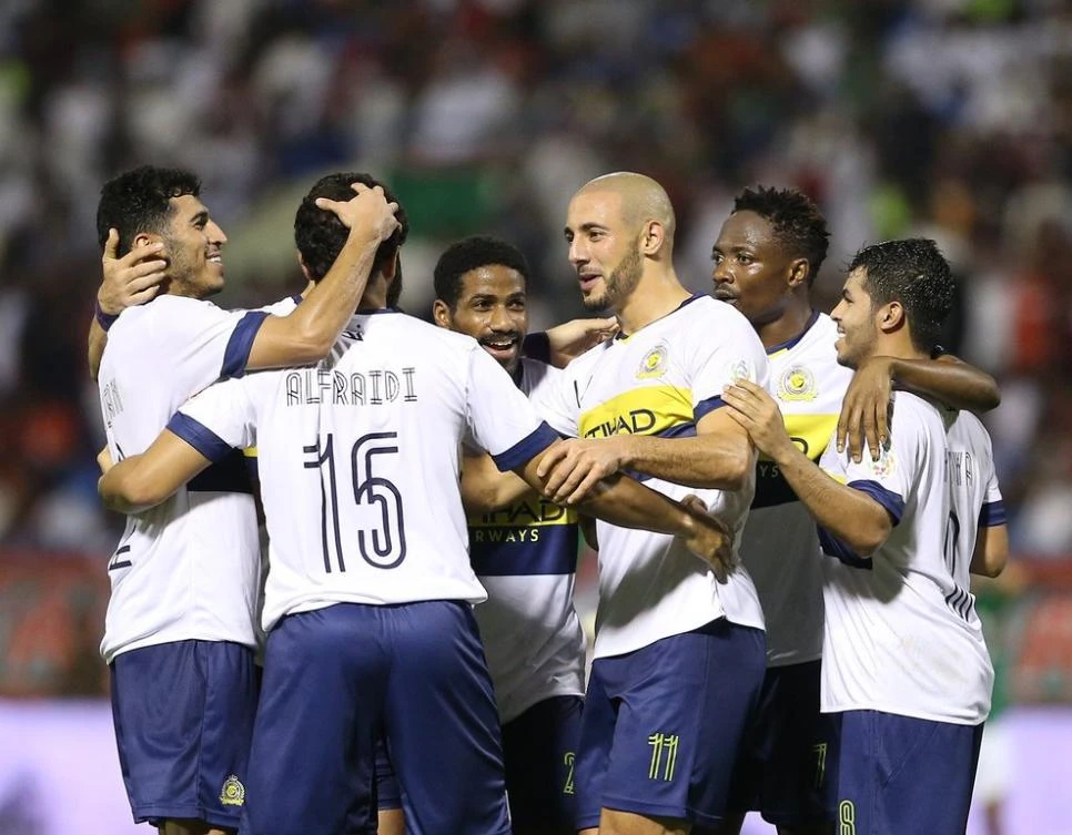 Amrabat, center, became Al-Nassr’s fourth costliest player ever when he joined from Watford for $10 million. (Twitter: @AlNassr)