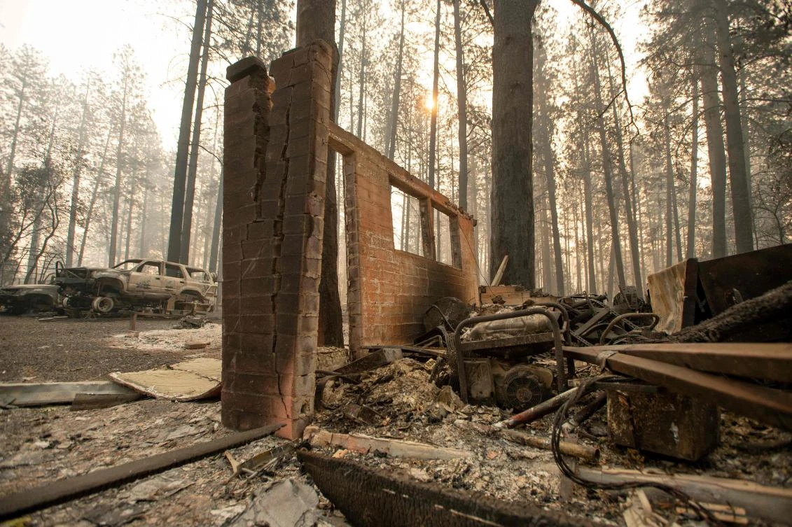A wall is all that remains of a home after the wildfire tore through the area in Paradise, California. (AFP)