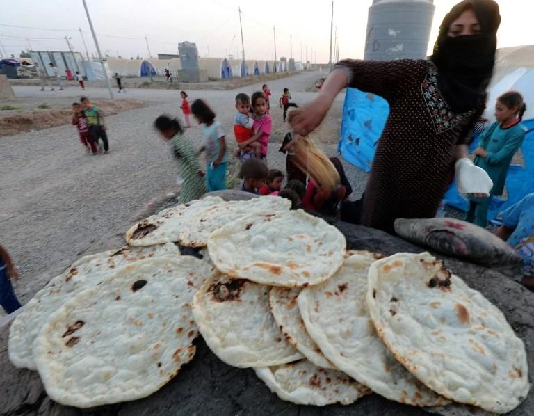 Iraq spends billions of dollars annually for food rationing, the Public Distribution System, to supply subsidized bread and other essential foods to its population. (AFP)