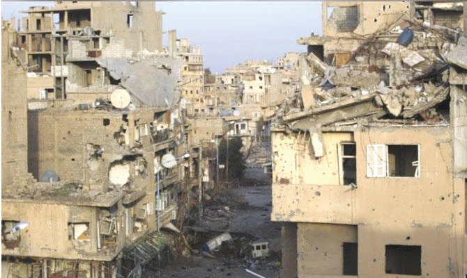 A view shows damaged buildings in Deir Ezzor. (Reuters)