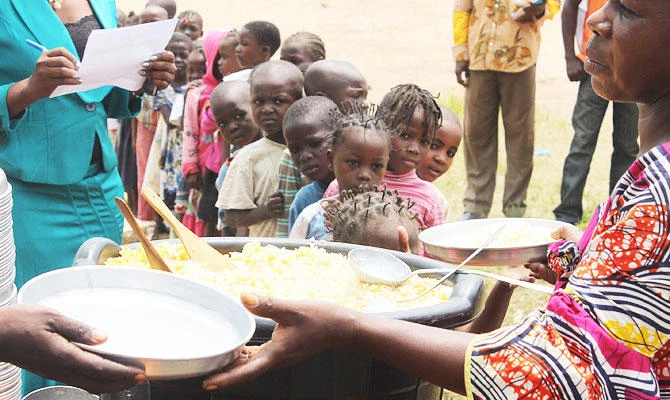 In this file photo taken on July 7, 2014 children wait in line during a food distribution by the Word Food Programme (WFP) at a school in Bangui. (AFP)
