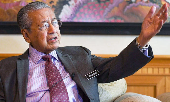 Malaysia's Prime Minister Mahathir Mohamad speaks during an interview with Agence France-Presse (AFP) in Putrajaya on November 1, 2018. (AFP)