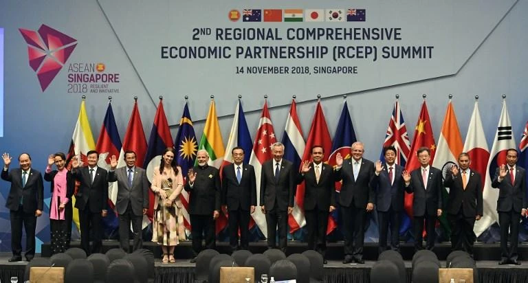 Leaders and representatives pose for a group photo during the second Regional Comprehensive Economic Partnership meeting on the sidelines of the Association of Southeast Asian Nations summit in Singapore on Wednesday, November 14. (AFP)