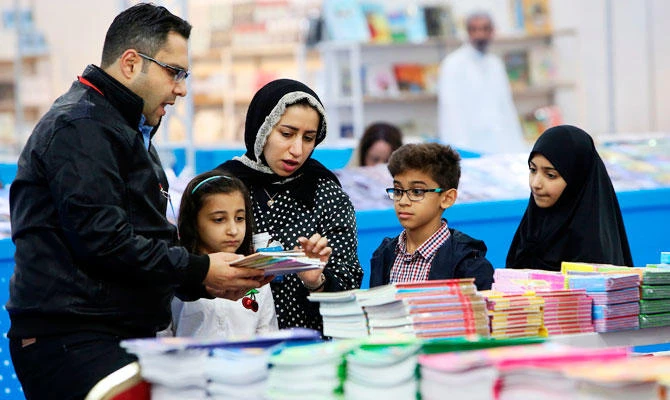 Kuwaitis attend the 43rd international book fair in Kuwait City on November 15, 2018. (AFP)