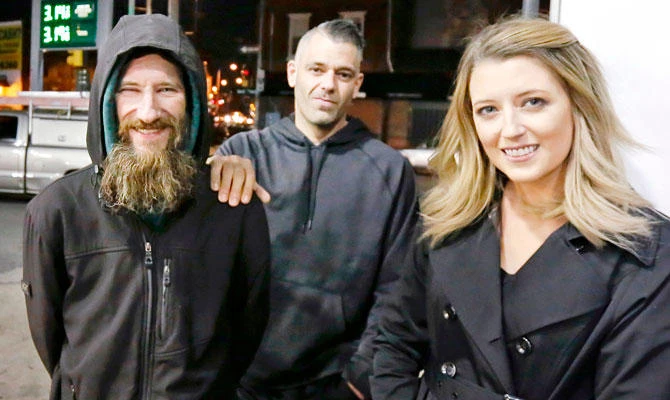 In this Nov. 17, 2017, file photo, Johnny Bobbitt Jr., left, Kate McClure, right, and McClure's boyfriend Mark D'Amico pose at a Citgo station in Philadelphia. (AP)