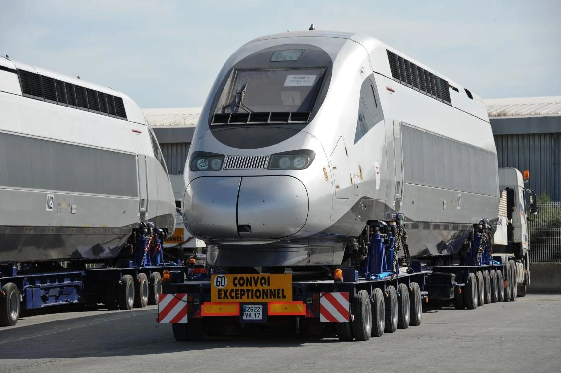 A carriage of a high speed train TGV produced by Alstom is loaded on a ship leaving for Tangiers, Morocco. (AFP)