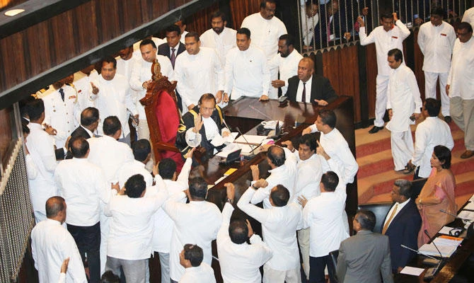 Bottles, chili paste thrown as Sri Lanka parliament descends into farce