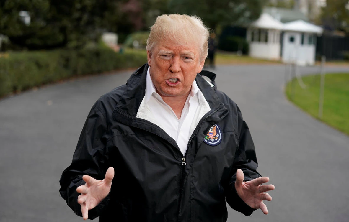 US President Donald Trump talks to the media on the South Lawn of the White House in Washington, US, before his departure to California, November 17, 2018. (Reuters)