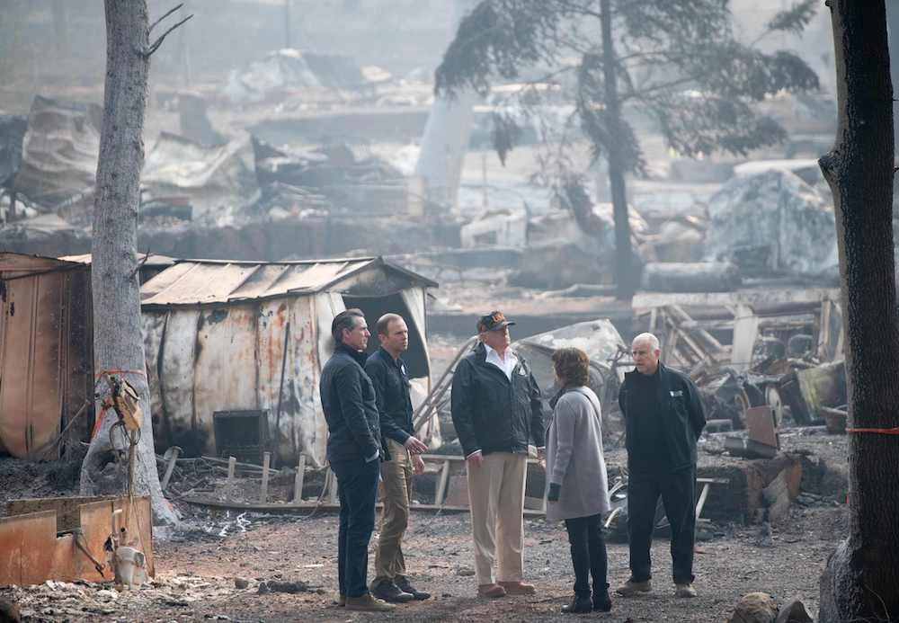 US President Donald Trump (C) views damage from the Camp fire in Paradise, California, November 17, 2018. (AFP)