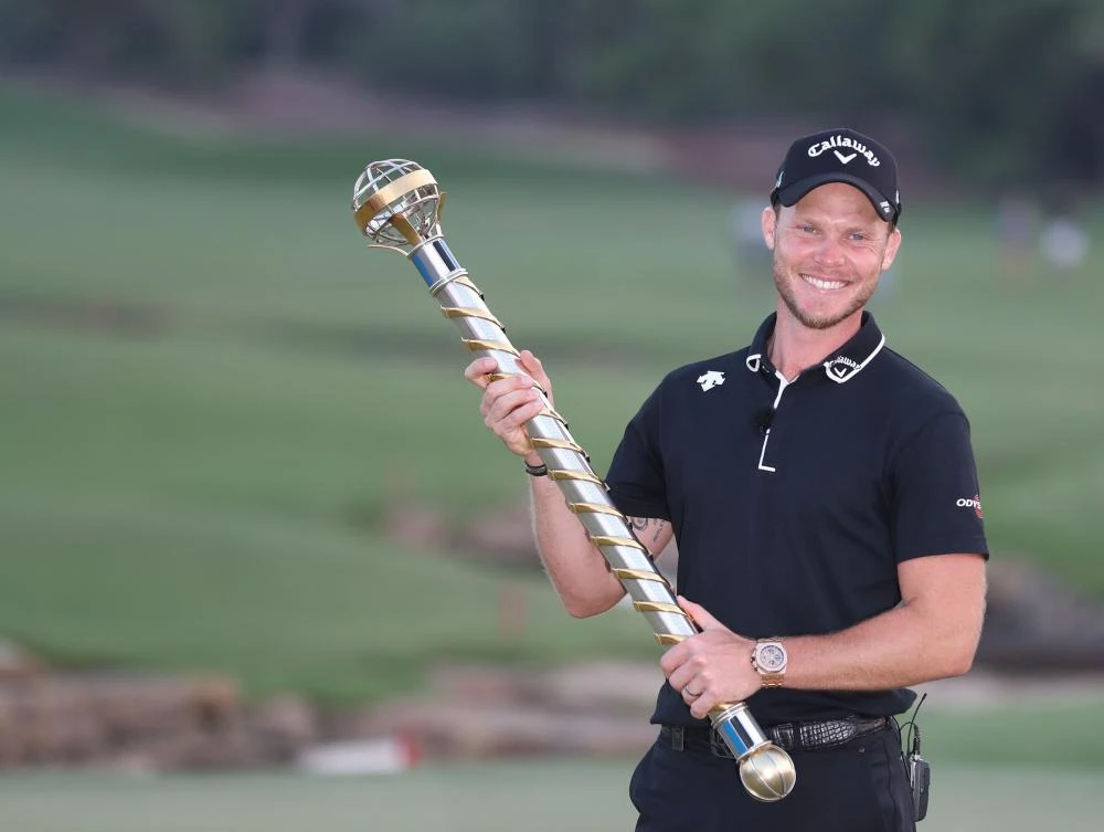 Danny Willett of England holds the DP World Tour trophy following victory in the final round of the DP World Tour Championship at Jumeirah Golf Estates in Dubai. (AFP)