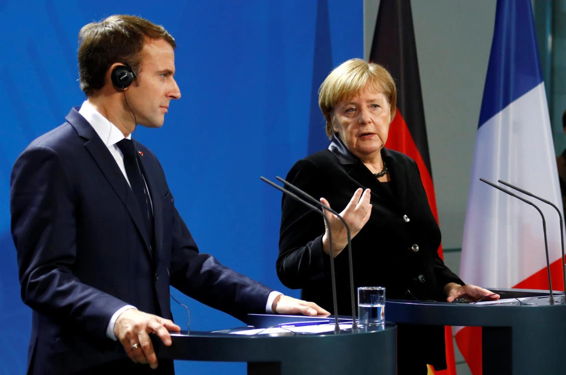 Macron, Merkel seek common approaches to Trump, euro