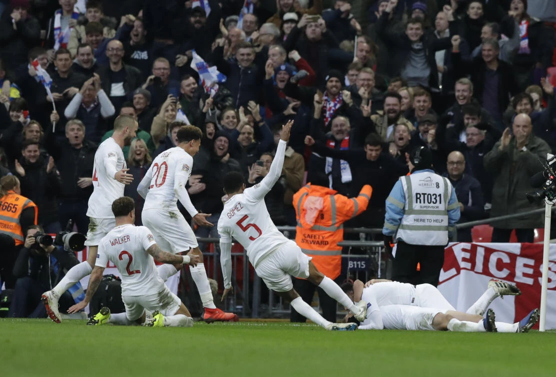 England's players celebrate their side's second goal during the UEFA Nations League soccer match between England and Croatia at Wembley stadium in London. (AP)
