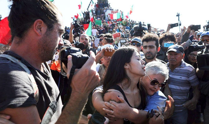 Tijuana protesters chant ‘Out!’ at migrants camped in city