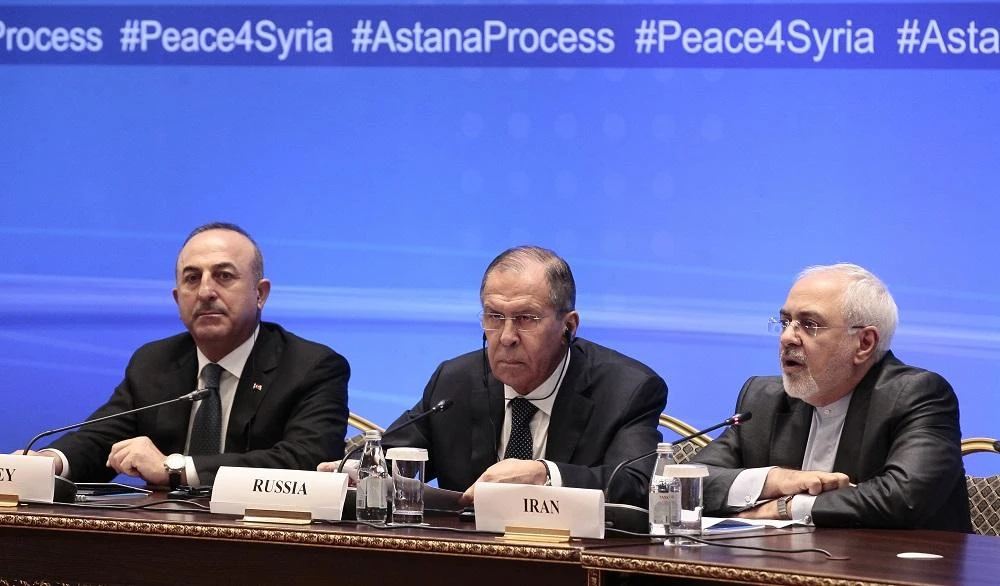 Russian Foreign Minister Sergei Lavrov (C), Iranian Foreign Minister Mohammad Javad Zarif (R) and Turkish Foreign Minister Mevlut Cavusoglu attend a meeting on Syria in Astana on March 16, 2018. (File/AFP)