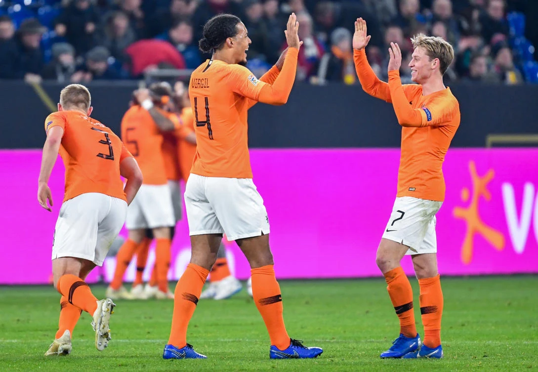 Netherlands' defender Virgil van Dijk celebrates scoring with Netherlands' midfielder Frenkie De Jong (R) during the UEFA Nations League football match against Germany. (AFP)