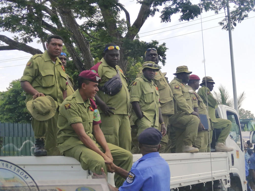 Security personnel wait to be paid their APEC bonuses just days after the international summit wrapped up on Tuesday, November 20. (AP)