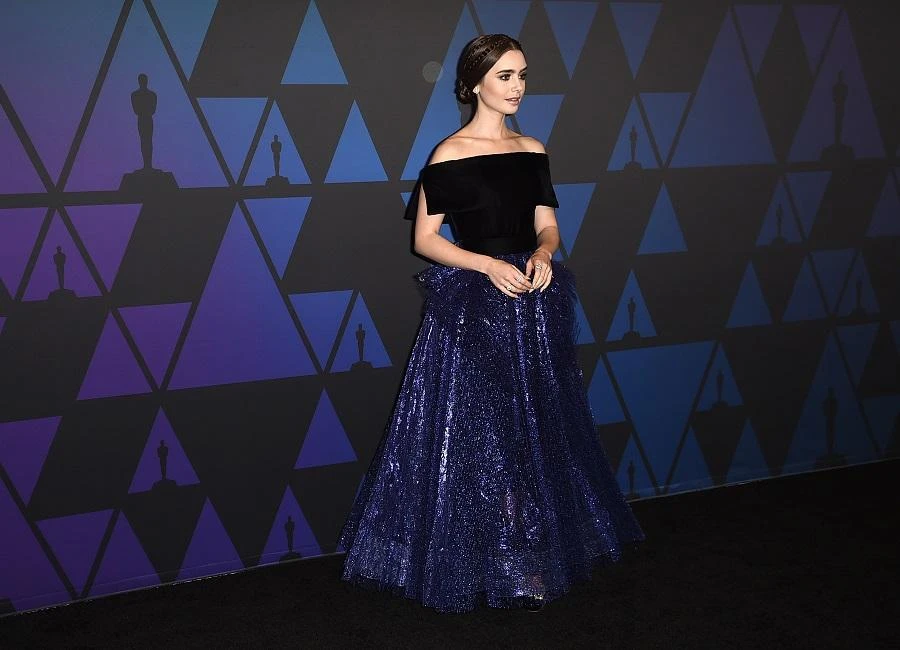 Lily Collins wore a gown by Georges Chakra. (AFP)