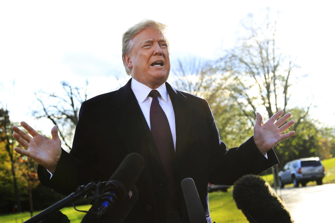 President Donald Trump speaks to the media before leaving the White House in Washington, Tuesday, Nov. 20, 2018. (AP)