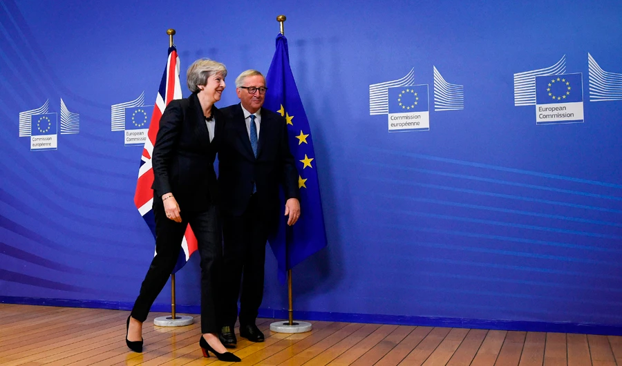 Days from summit, May takes Brexit battle to Brussels