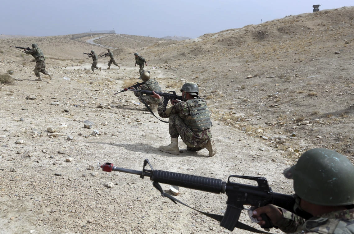 Afghan National Army soldiers carry out a training exercise in Kabul against near-daily attacks from the Taliban. (AP)
