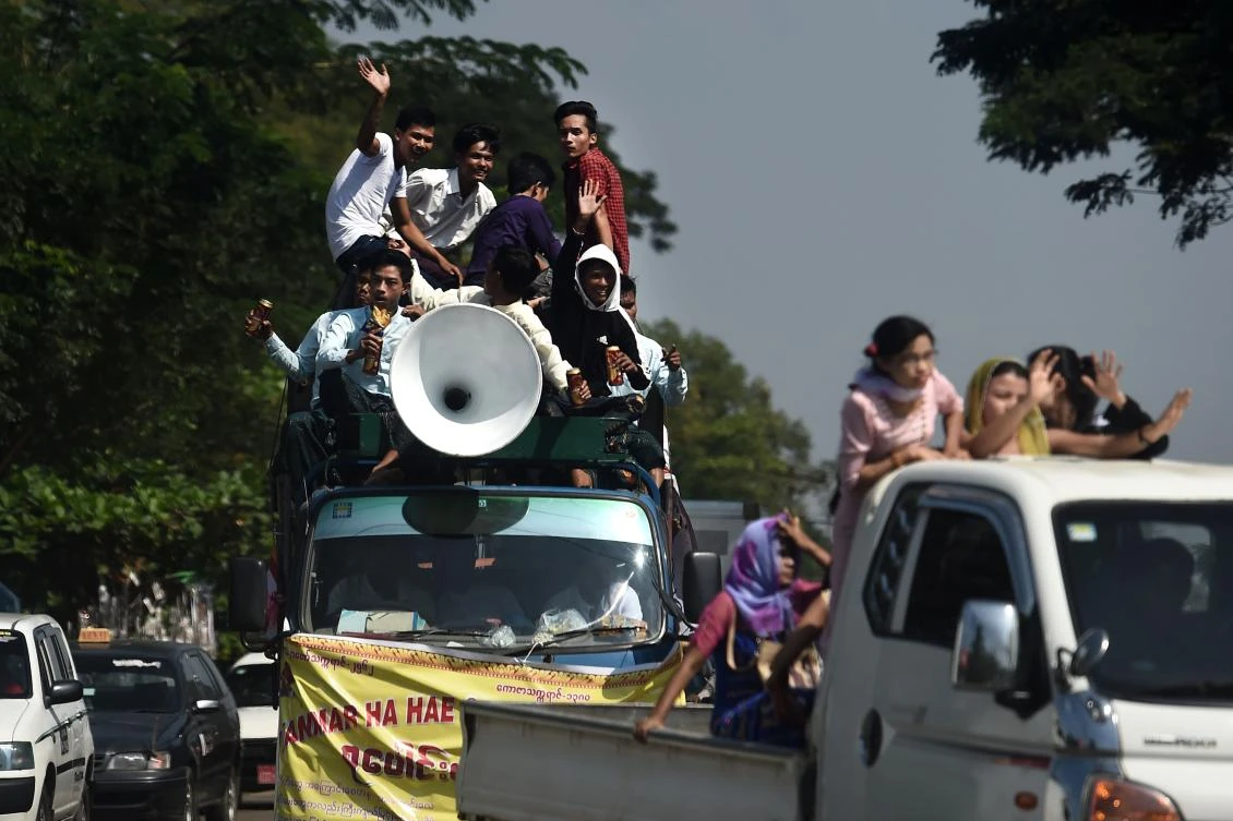 Devotees play loud traditional music during Buddhist religious festivities in Yangon. (AFP)