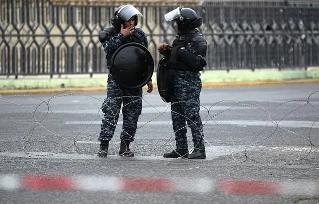 File photo showing Iraqi security forces standing guard following protests in the Green Zone. (AFP)