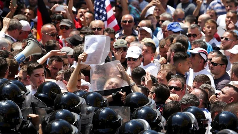 Opposition Democratic Party supporters clash with police in Tirana. Protesters also tried to force their way into Parliament after a government decision to demolish their houses for a new road. (Reuters)