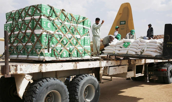 In this Feb. 3, 2018 file photo, relief workers unload aid carried into Yemen by the Saudi military in Marib, Yemen. (AP)