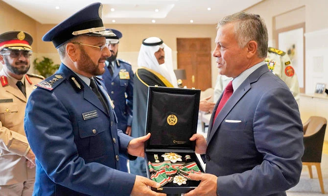 A handout photo released by the Jordanian Royal Palace on November 22, 2018 shows Jordan's King Abdullah II (R) presenting General Fayyad bin Hamed Al Ruwaili (L), Saudi Arabia's Armed Forces' Chairman of the General Staff, with the Order of Military Merit of the First Degree during their meeting in the capital Amman. (AFP)