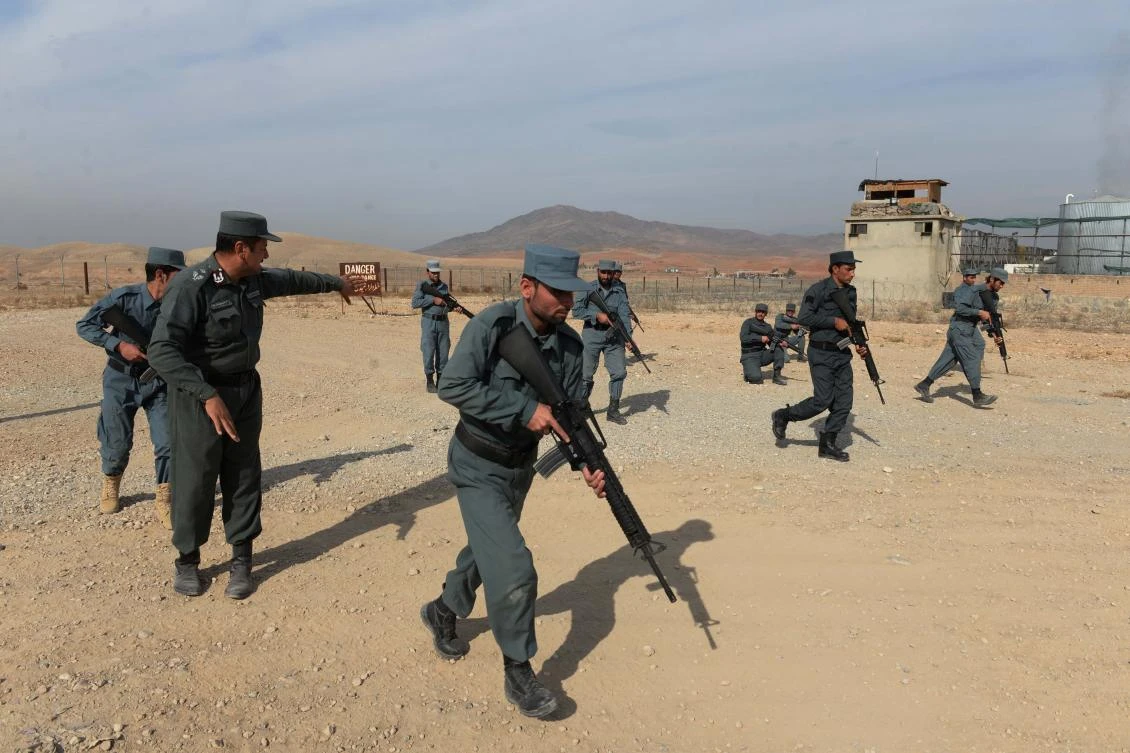 Afghan policemen display their skills at a police training center on the outskirts of Jalalabad in Nangarhar province. (AFP)