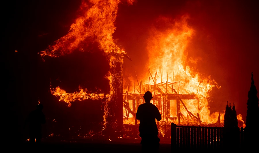 A home burns as the Camp Fire rages through Paradise, Calif. (File/AP)