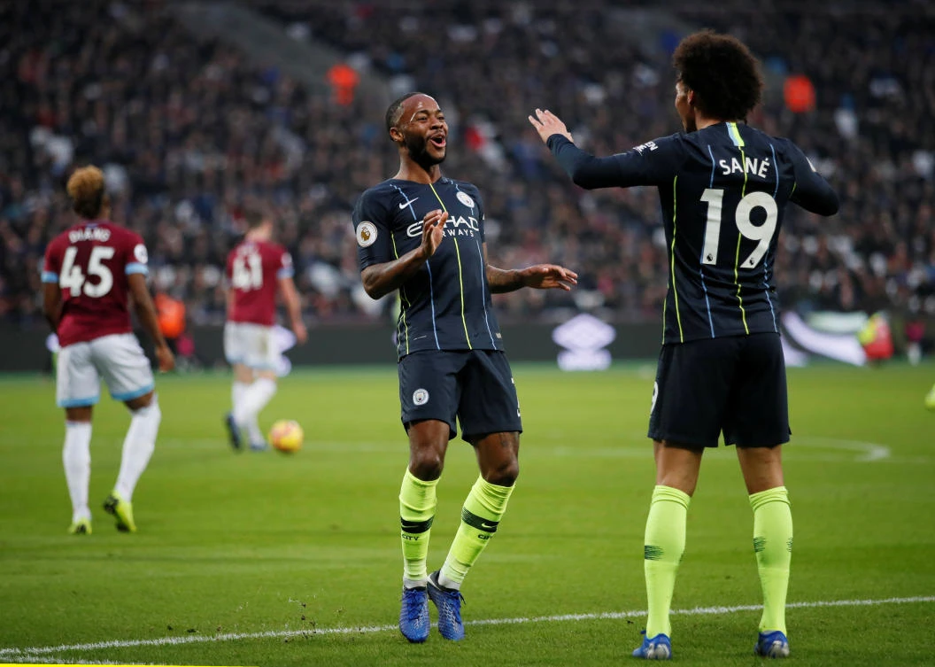 Manchester City's Raheem Sterling celebrates scoring their second goal with Leroy Sane (Reuters)