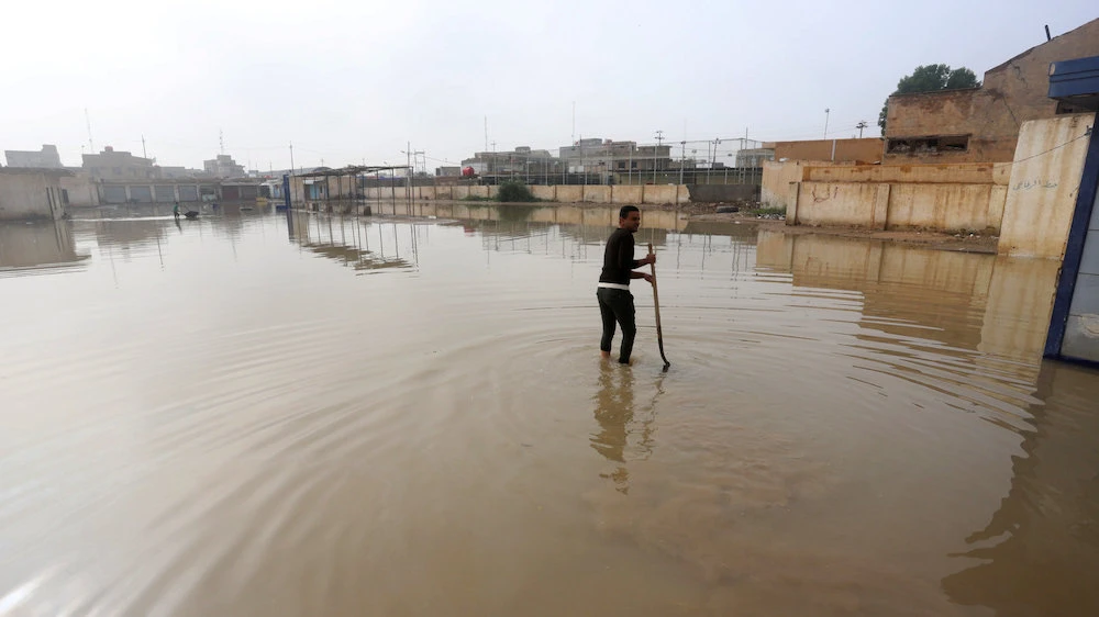 Emergency workers in Iraq struggle to help flood victims