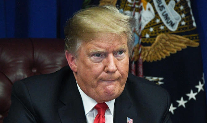 US President Donald Trump says he doesn’t believe his own government’s report warning of massive economic losses if carbon emissions continue to feed climate change unchecked. ( AFP / Jim Watson)
