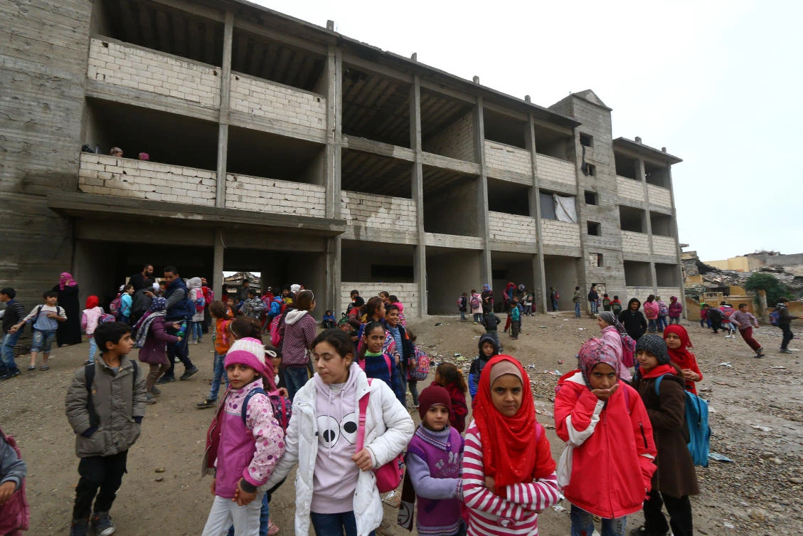 School children stand at a playground of a school in Raqqa, Syria November 5, 2018. Picture taken November 5, 2018. (Reuters)