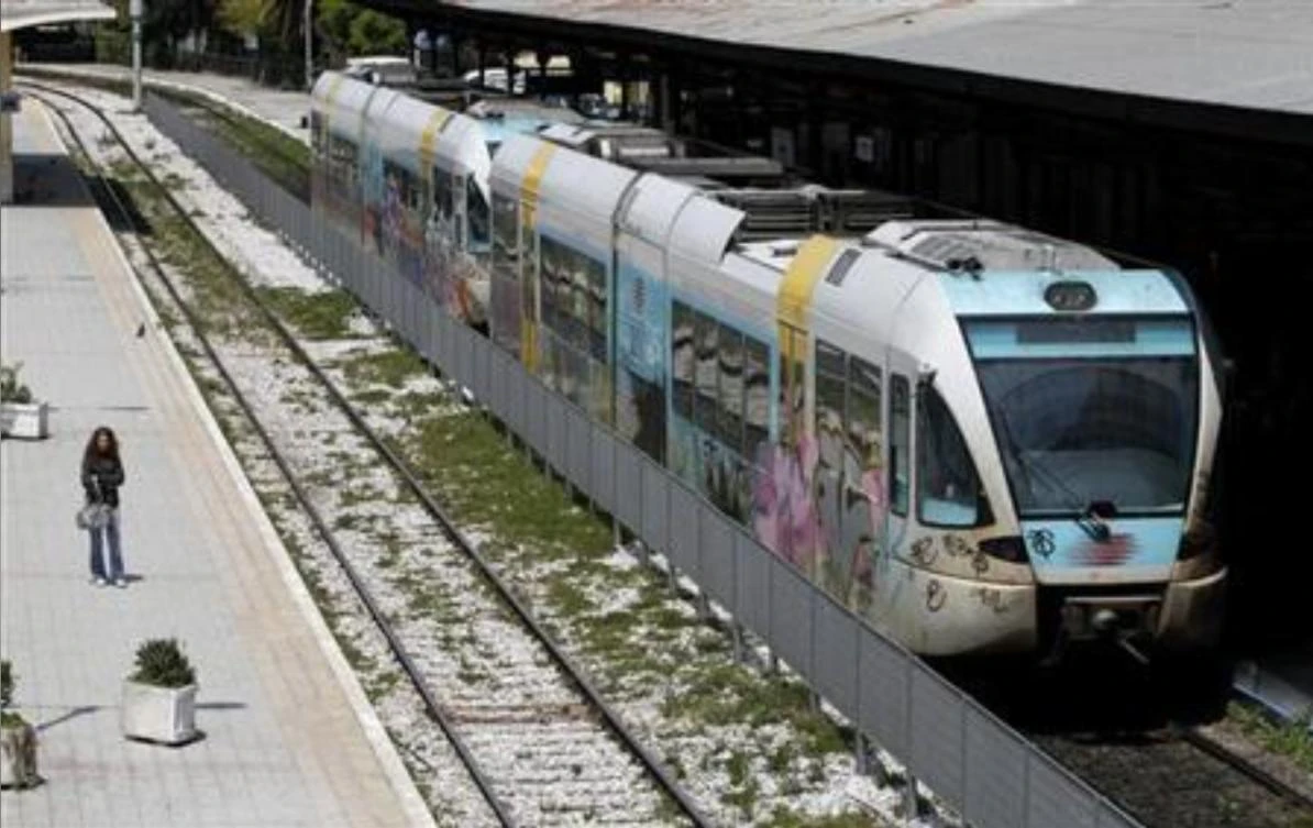 File photo shows a woman standing alongside a central train station in Athens May 10, 2011. (Reuters)