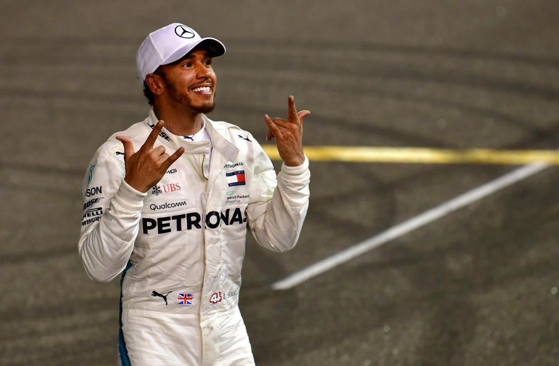 The all too familiar sight of Lewis Hamilton celebrating a race win. (AFP)