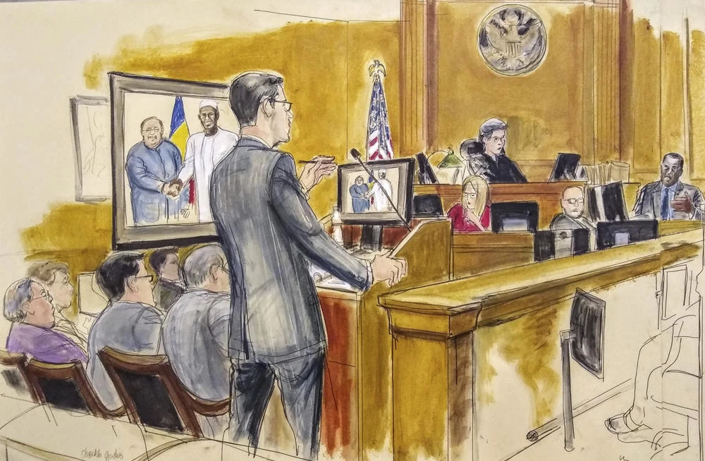 In this courtroom drawing, Assistant US Attorney Douglas Zolkind, standing, addresses cooperating witness Cheikh Gadio, far right, during Hong Kong businessman Dr. Chi Ping Patrick Ho’s bribery trial in New York on Nov. 28, 2018. Seated at far left is the defendant, Dr. Chi Ping Patrick Ho. (Elizabeth Williams via AP)